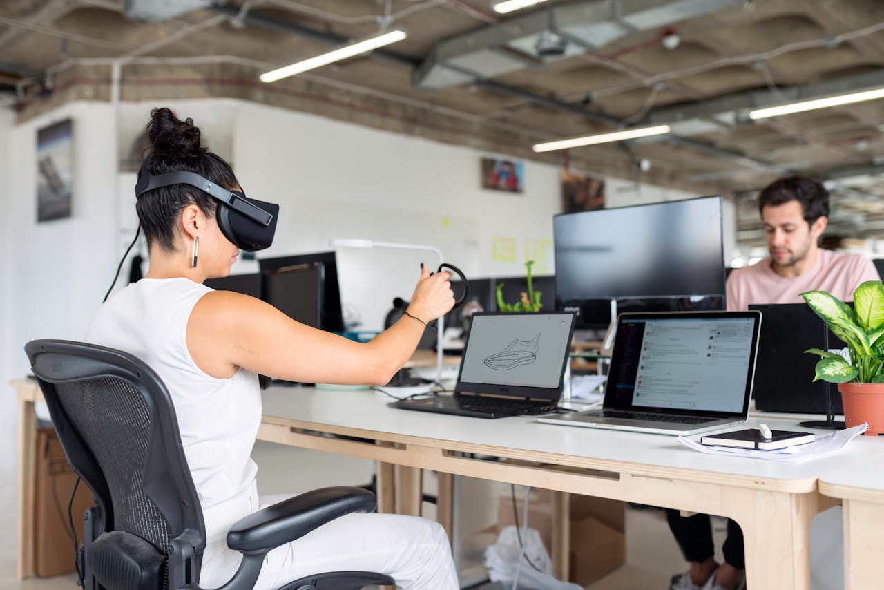 service-03 Woman using virtual reality headset in a modern office for design and innovation.