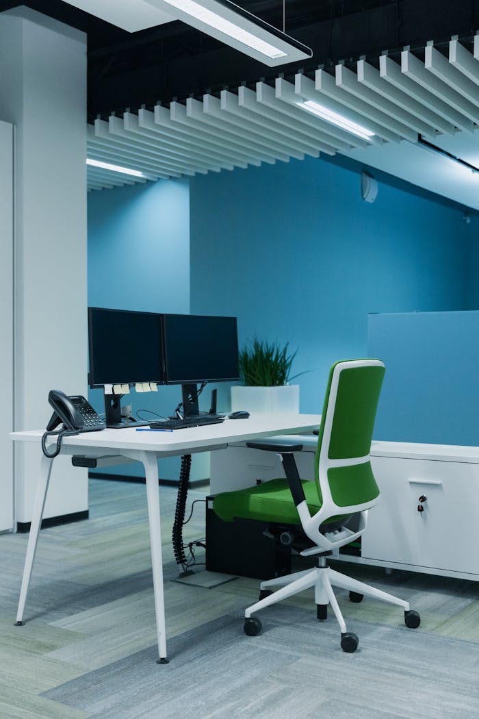 who-we-are Contemporary office setup featuring dual monitors and ergonomic design for productivity.